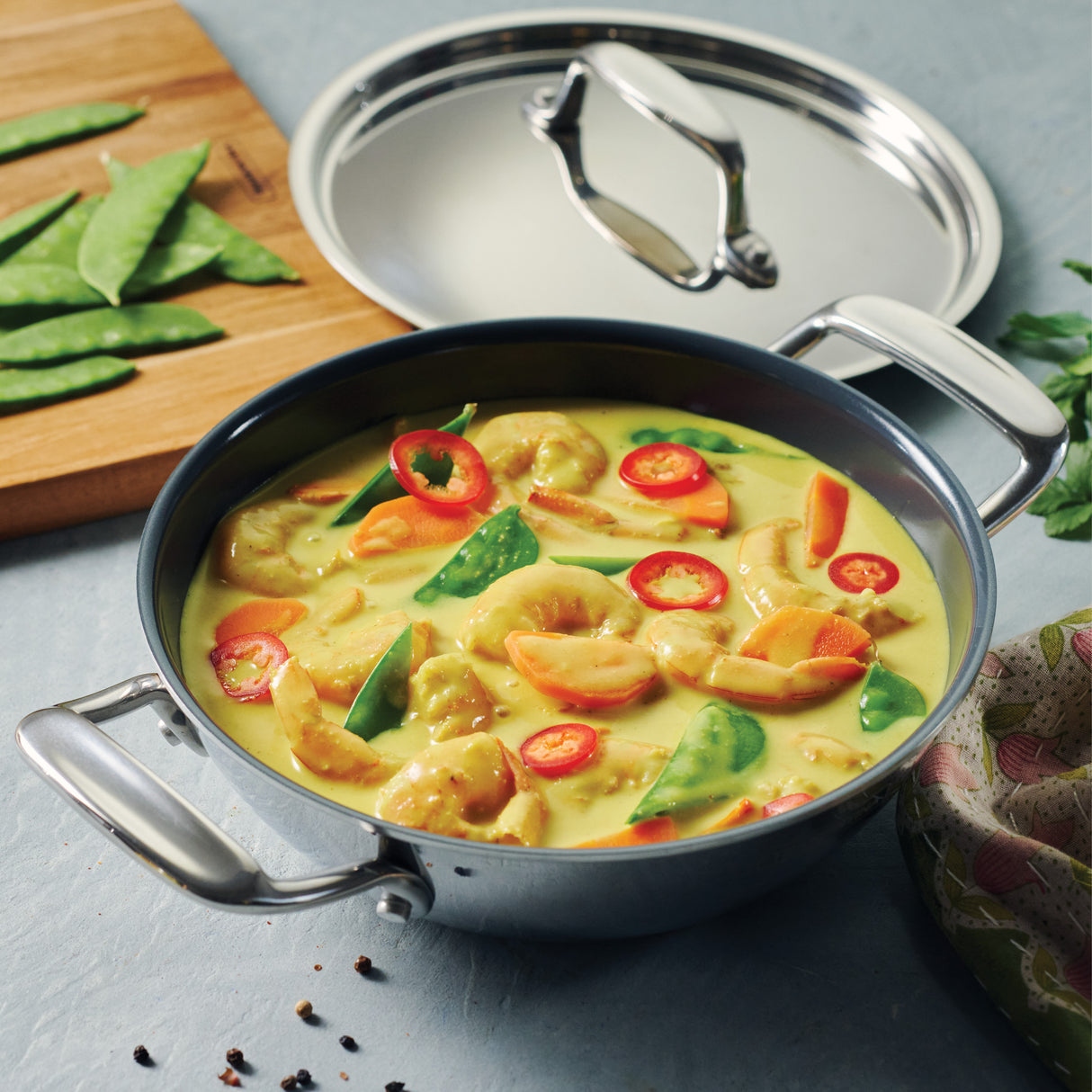 Utsava Tri-Ply Clad Covered Kadai with Ceramic Interior